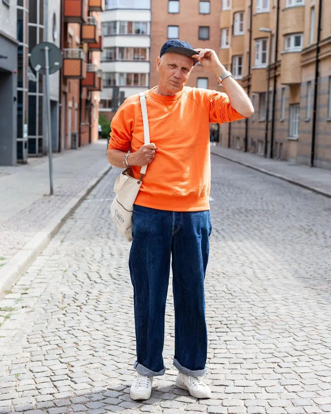 Light Blue Jeans Outfit Men Over 40 Actually Look Good In 14 Vibrant Orange Sweatshirt and Dark Denim