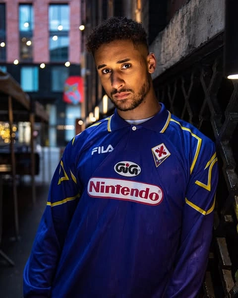 Men's World Cup Outfits That Score Big on Style 10 Vintage Blue Jersey with Graphic Logos